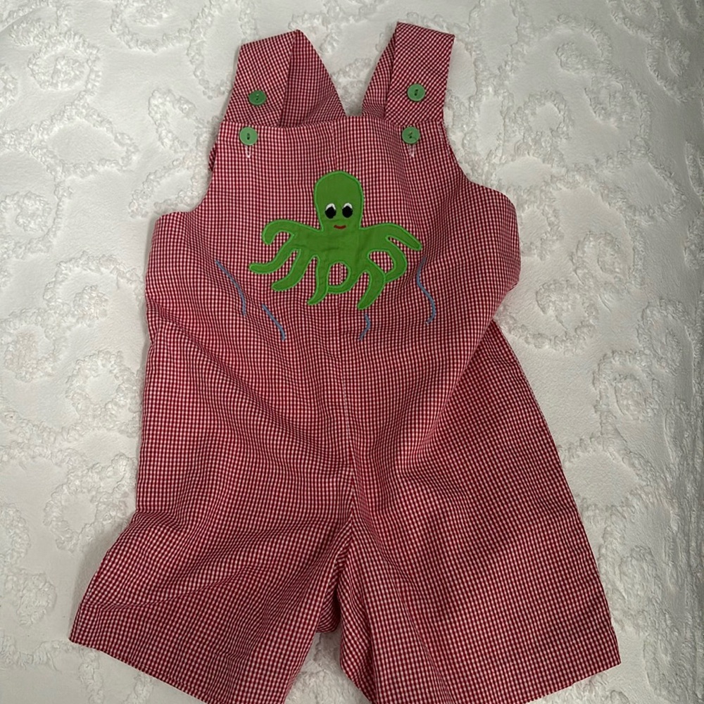 Adorable red checked jon jon with green octopus appliqué.